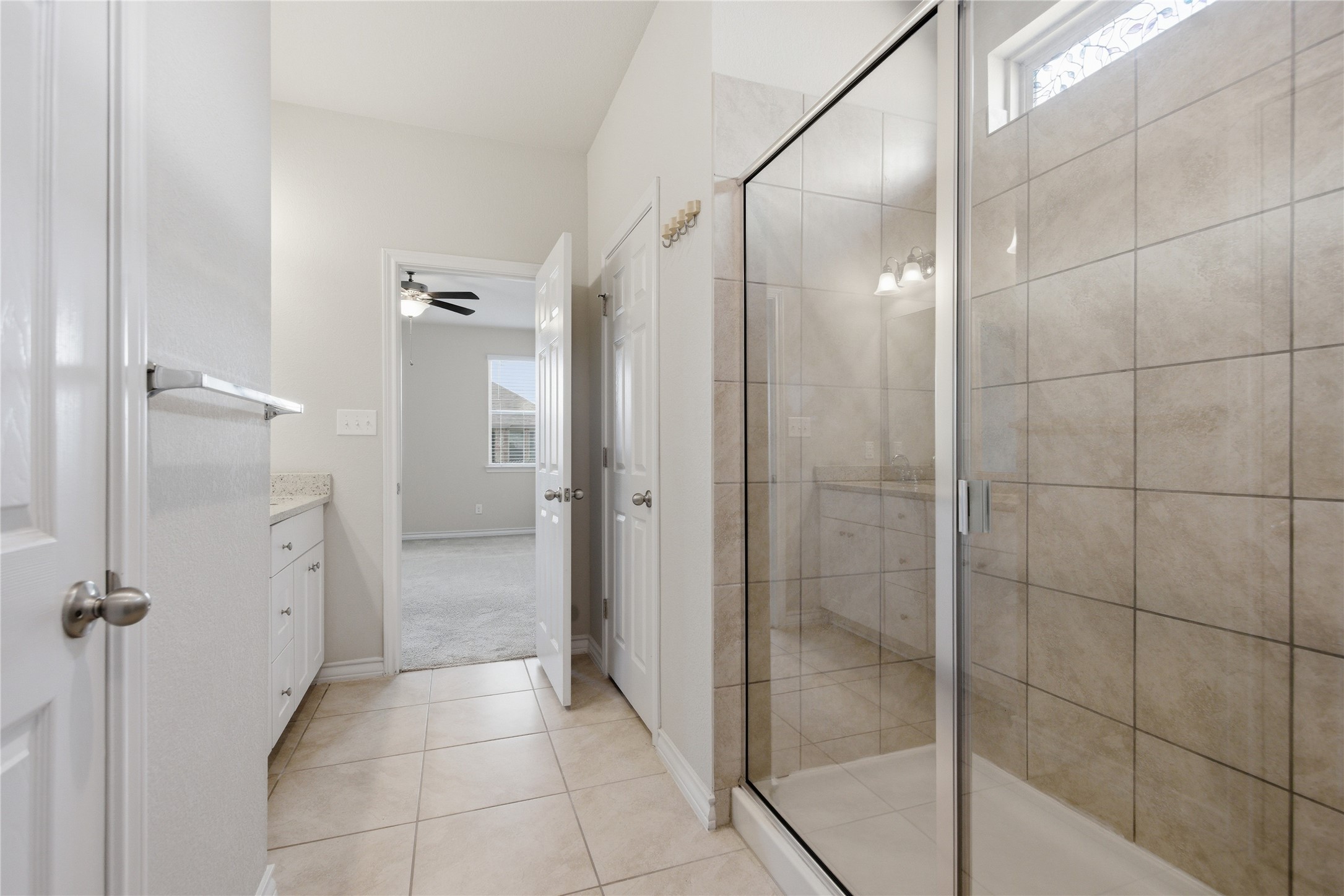 6764 Catania Loop Round Rock, TX 78665 - Photo 25 of 33 a bathroom with a shower and a glass door