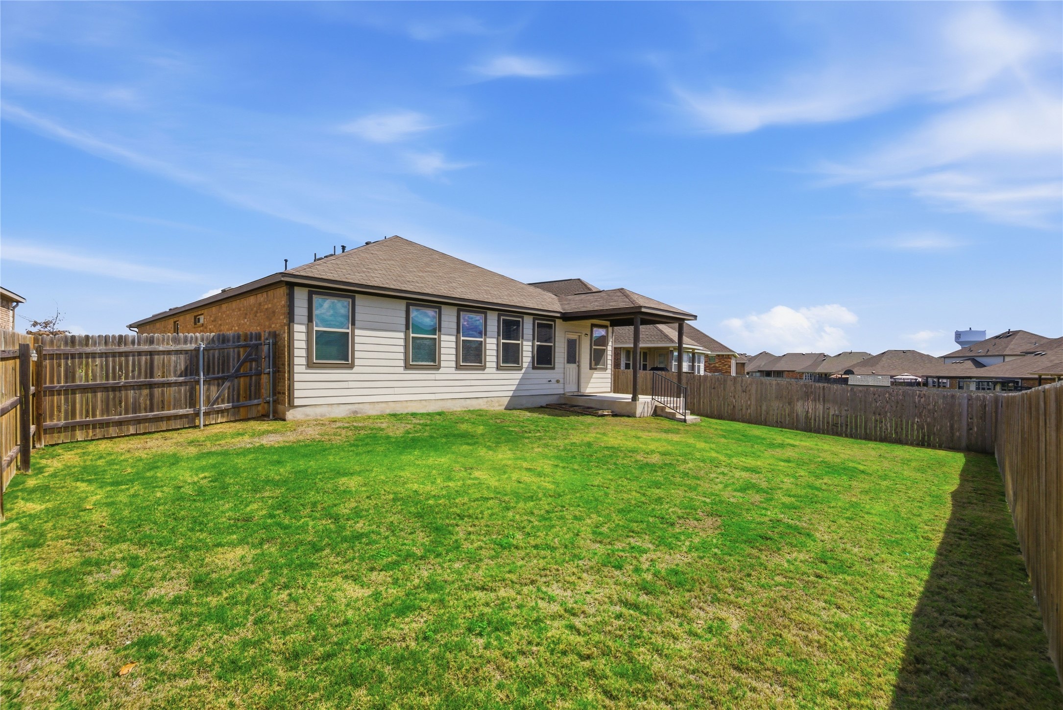 6764 Catania Loop Round Rock, TX 78665 - Photo 29 of 33 a view of a house with backyard porch and garden