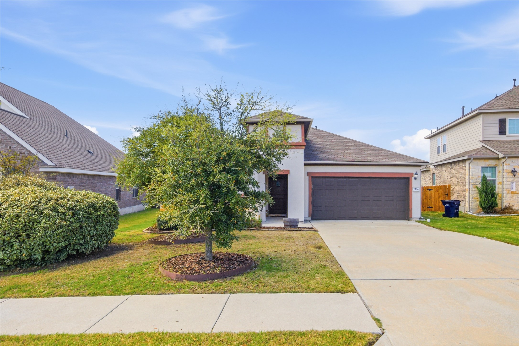 6764 Catania Loop Round Rock, TX 78665 - Photo 3 of 33 a front view of a house with garden
