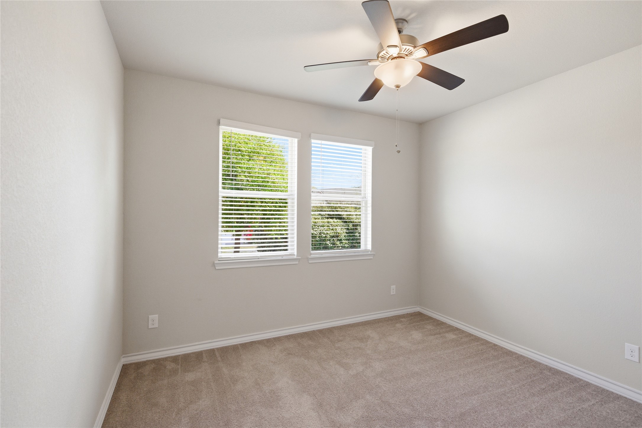 6764 Catania Loop Round Rock, TX 78665 - Photo 6 of 33 an empty room with a window and a fan