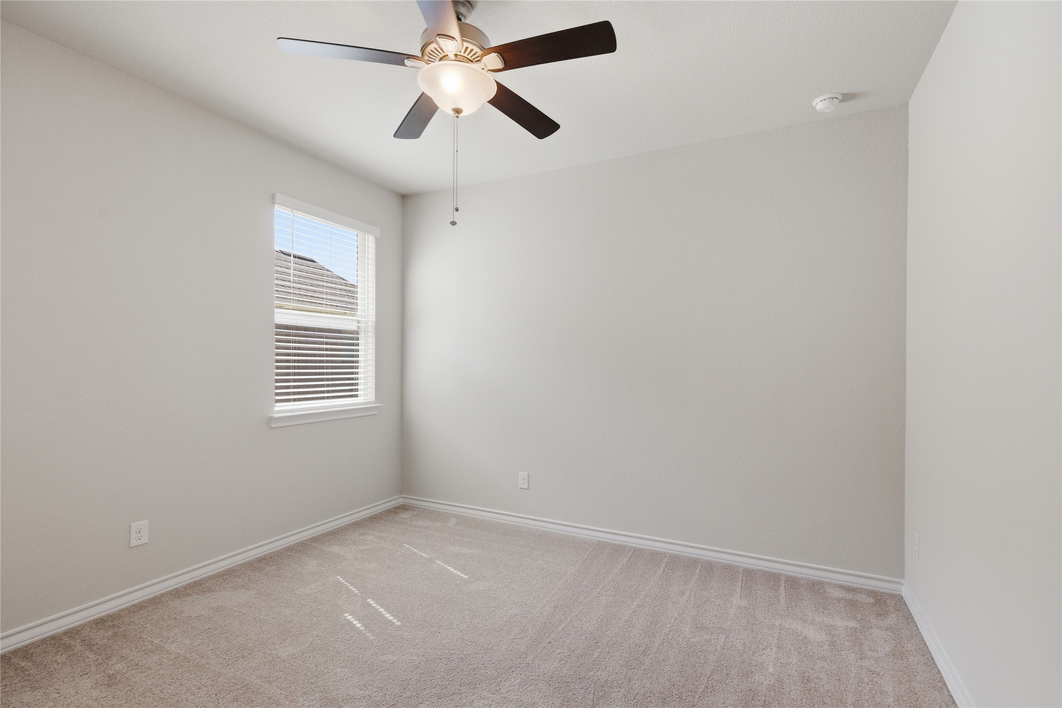 6764 Catania Loop Round Rock, TX 78665 - Photo 7 of 33 an empty room with windows and fan