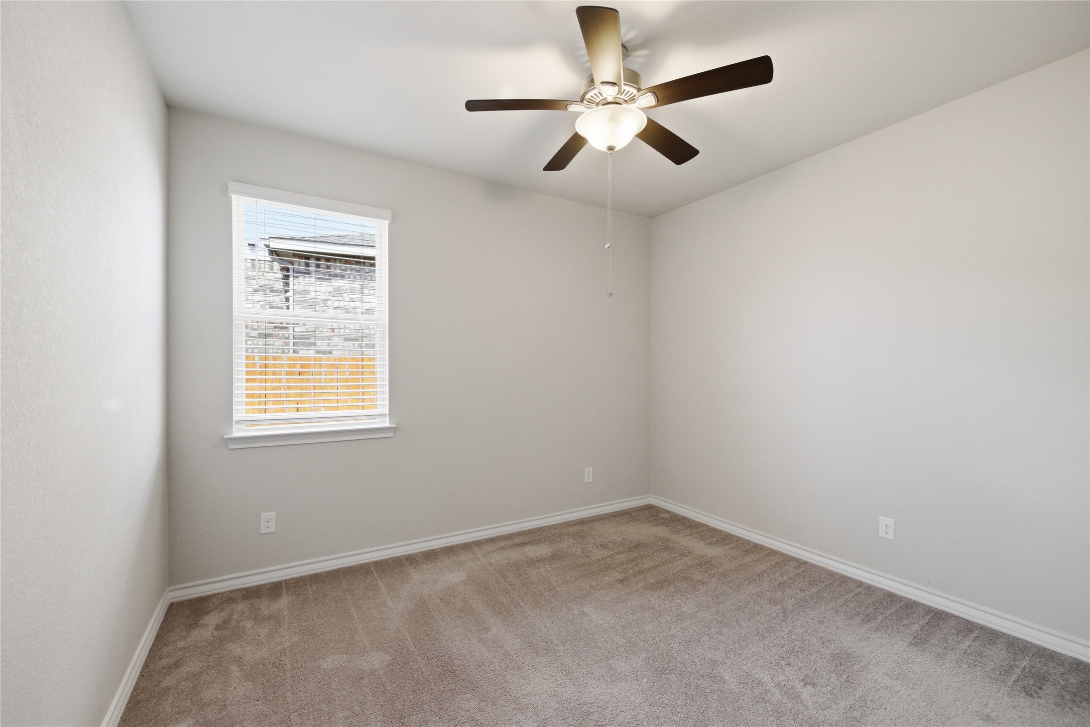 6764 Catania Loop Round Rock, TX 78665 - Photo 9 of 33 an empty room with a window and a fan