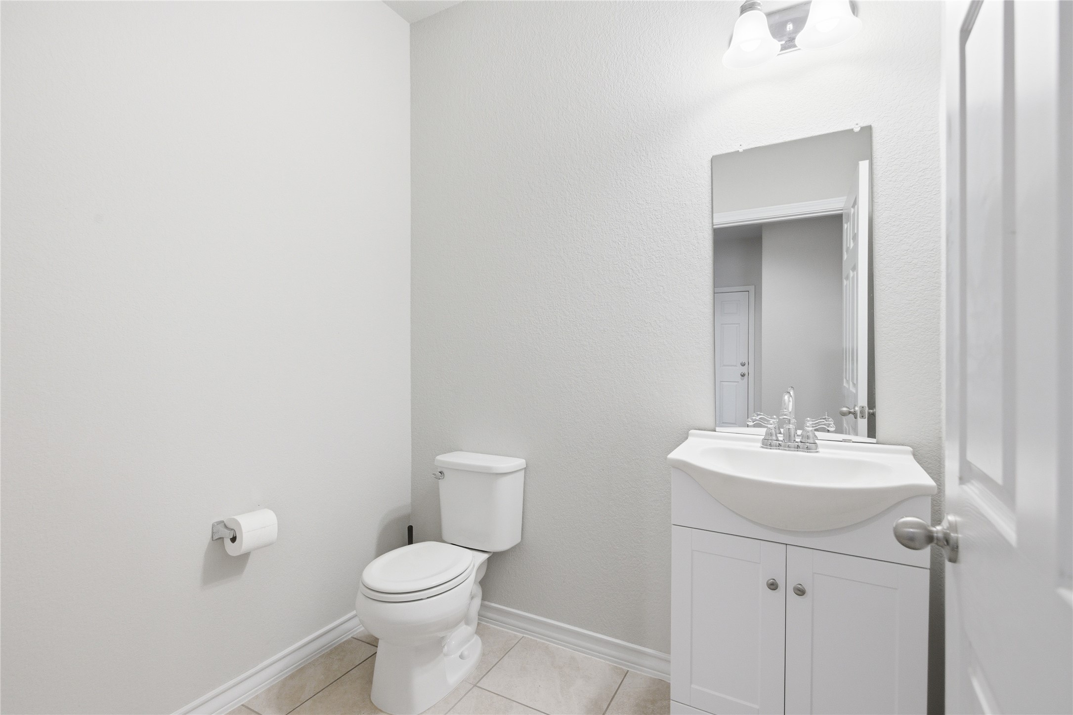 6764 Catania Loop Round Rock, TX 78665 - Photo 10 of 33 a bathroom with a toilet sink and mirror