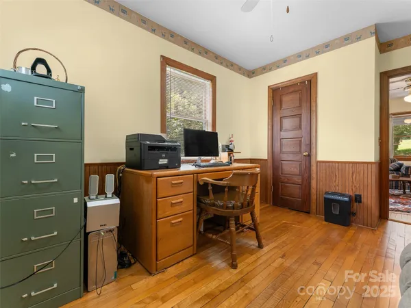 a view of a workspace with furniture
