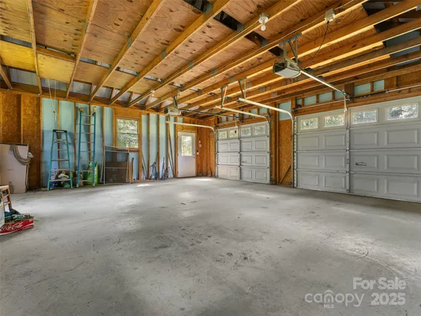 a view of an empty room with windows