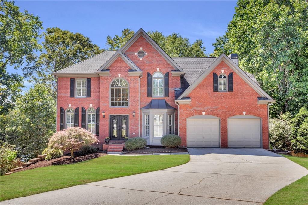 315 Morning Mist Walk Suwanee, GA 30024 - Photo 1 of 1 a front view of a house with a yard