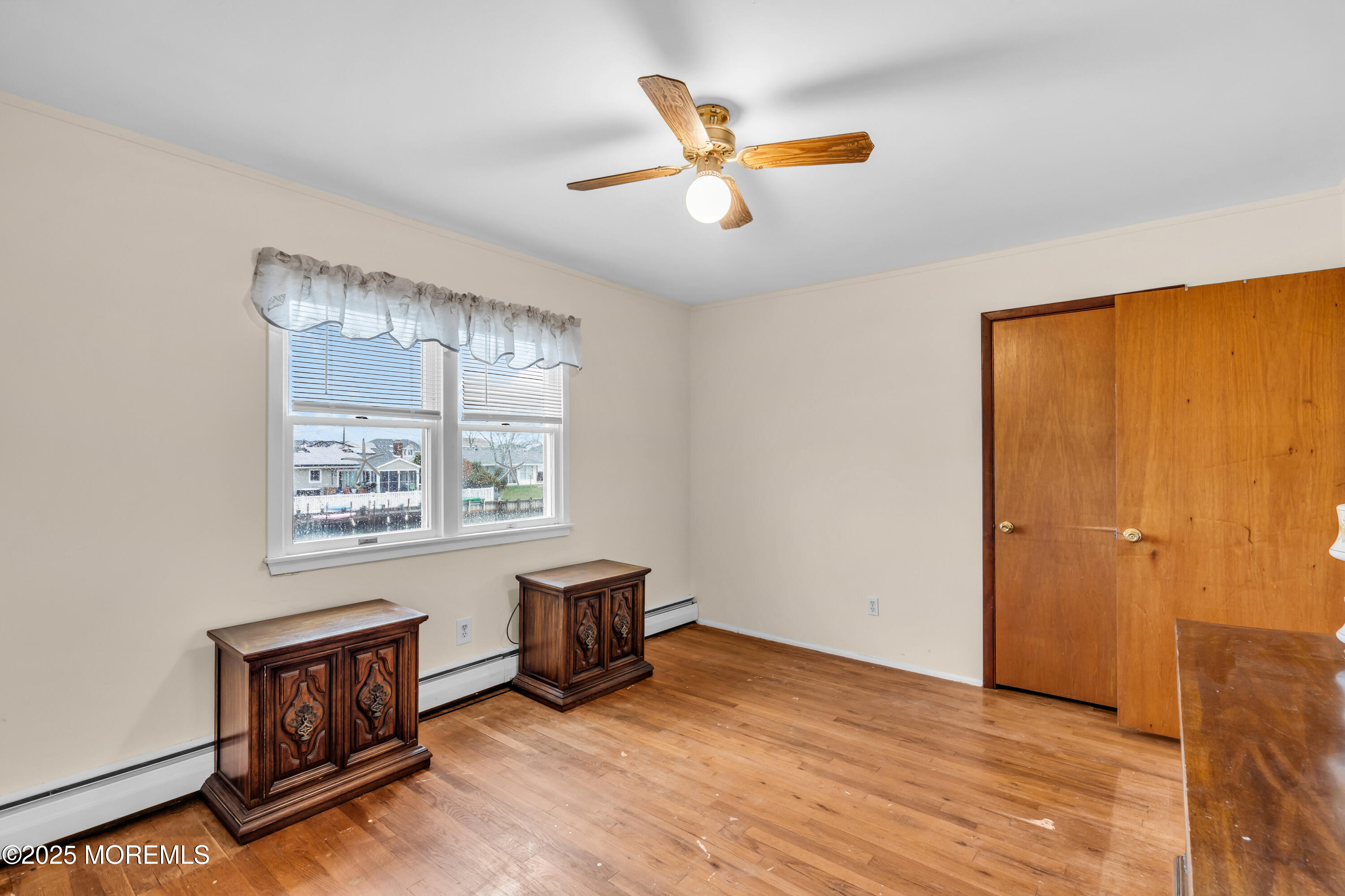220 Montclair Road South Barnegat, NJ 08005 - Photo 30 of 48 an empty room with windows and ceiling fan