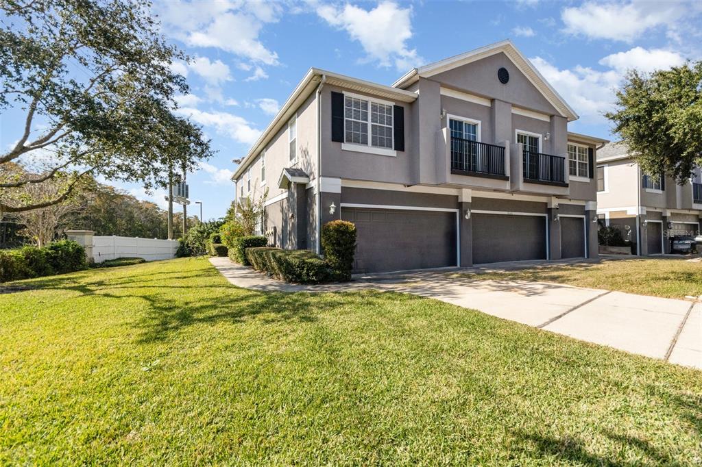 6686 South Goldenrod Road, Unit 139A Orlando, FL 32822 - Photo 2 of 23 a front view of a house with a yard