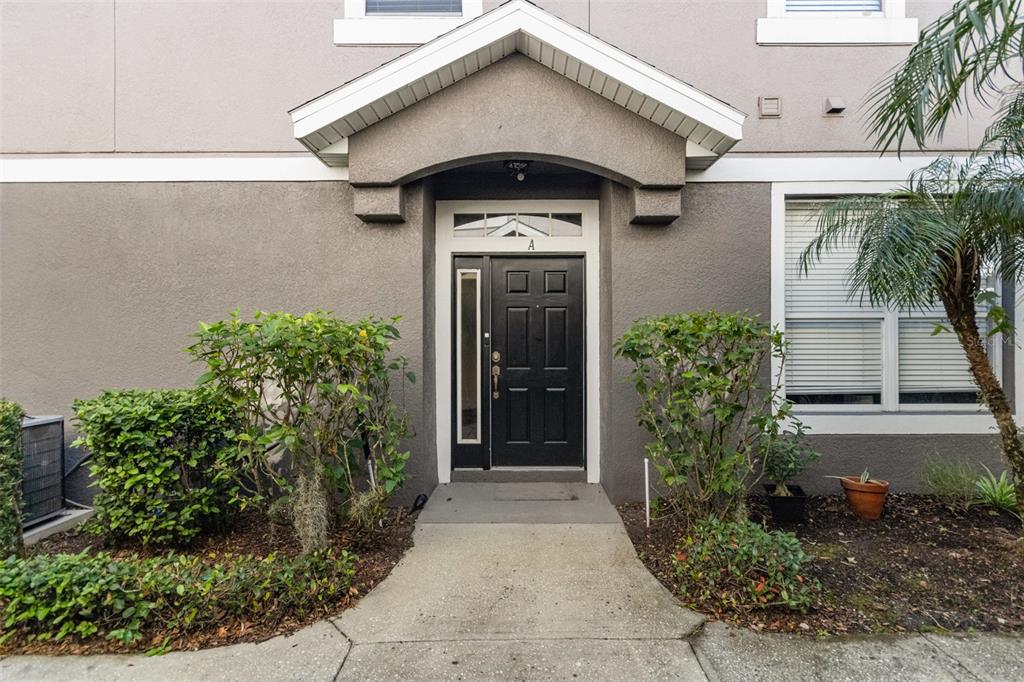 6686 South Goldenrod Road, Unit 139A Orlando, FL 32822 - Photo 4 of 23 a front view of a house with garden