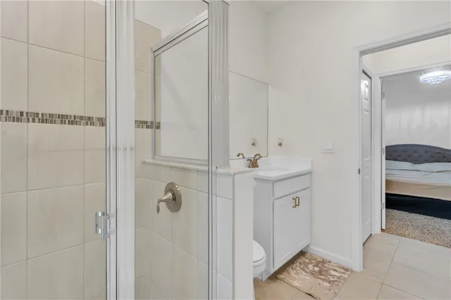 a bathroom with a sink a mirror and shower