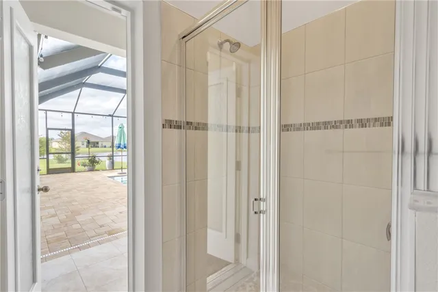 a view of a bathroom from a glass door