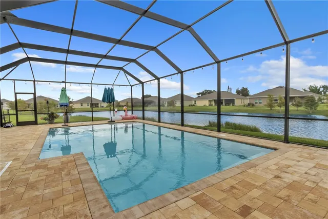 a view of a swimming pool with a porch