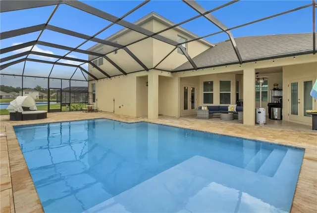 a view of a livingroom with wooden floor and furniture