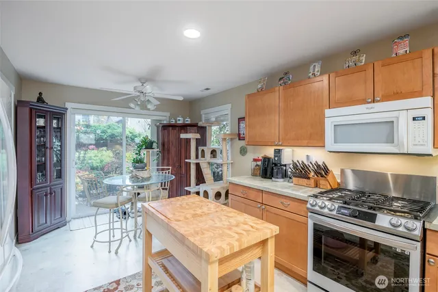 a kitchen with a stove a sink and a refrigerator