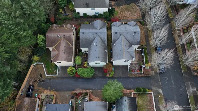 an aerial view of multiple houses with outdoor space