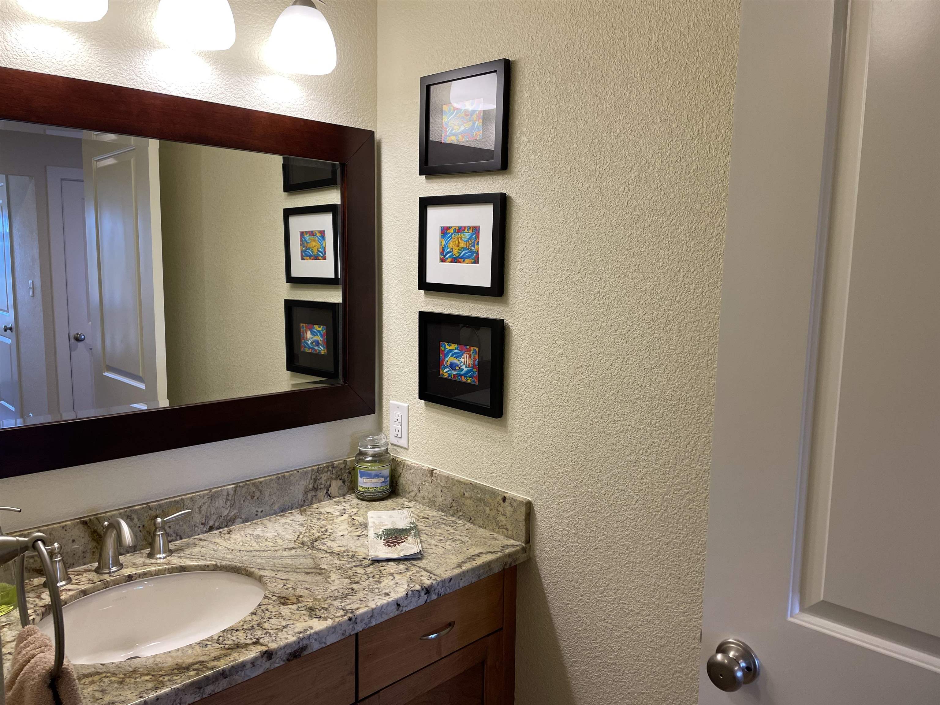 831 Timber Ridge Road Lake Almanor, CA 96137 - Photo 23 of 36 a bathroom with a granite countertop sink and a mirror