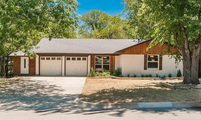 a house with trees in the background