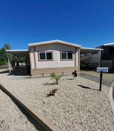 6480 Katherine Road, Unit 6 Simi Valley, CA 93063 - Photo 1 of 13 a house view with a backyard space