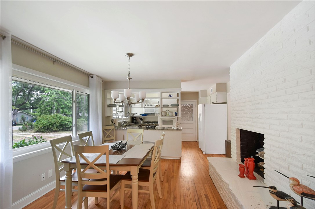 106 Dodge Road St. Simons Island, GA 31522 - Photo 10 of 24 Dining room with fireplace