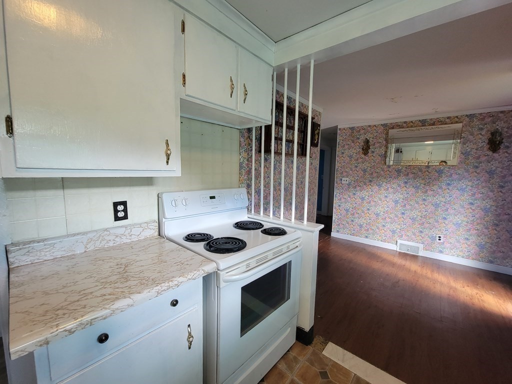 52 Ella Street Athol, MA 01331 - Photo 11 of 23 a kitchen with granite countertop a stove and a sink
