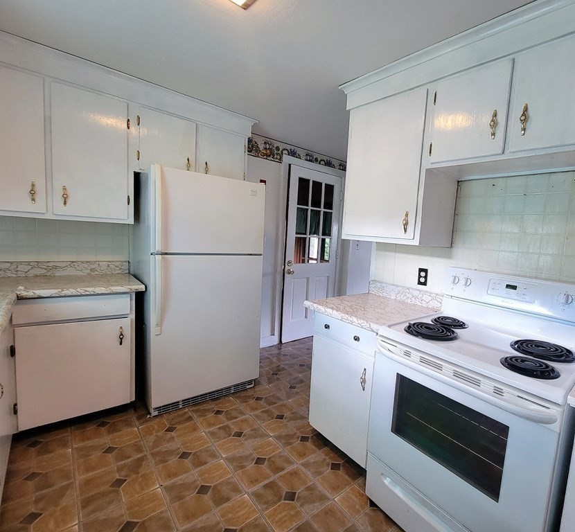52 Ella Street Athol, MA 01331 - Photo 14 of 23 a kitchen with a stove sink and refrigerator