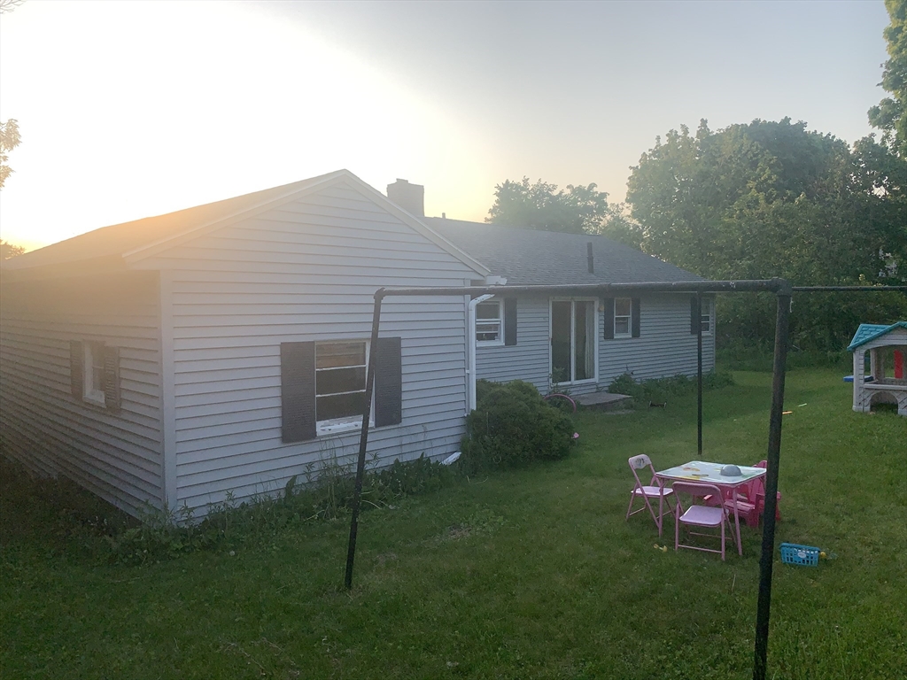 52 Ella Street Athol, MA 01331 - Photo 3 of 23 a backyard of a house with lots of green space