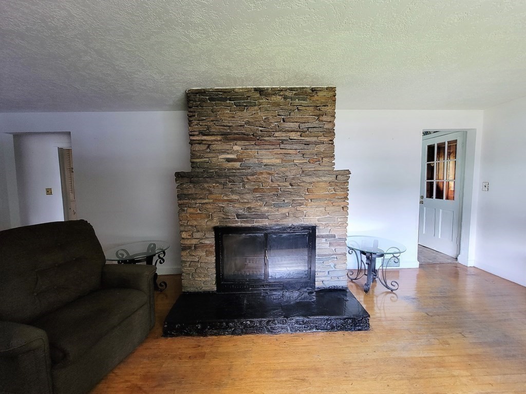 52 Ella Street Athol, MA 01331 - Photo 9 of 23 a living room with furniture and a fireplace