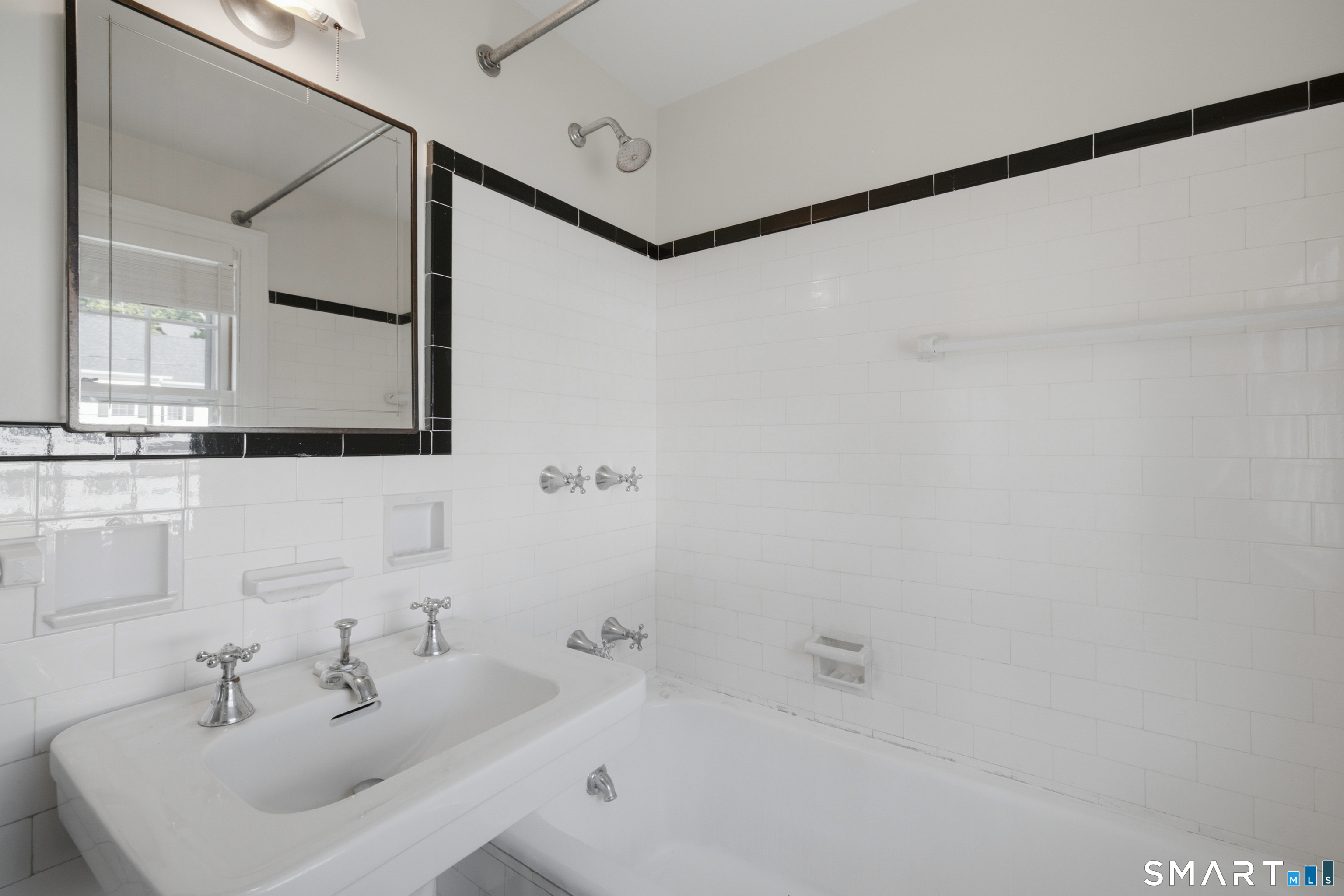 9 Stratford Road West Hartford, CT 06117 - Photo 22 of 40 The primary bathroom offers a comfortable space to start and end each day