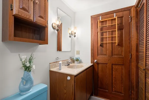 a bathroom with a sink a vanity and a mirror