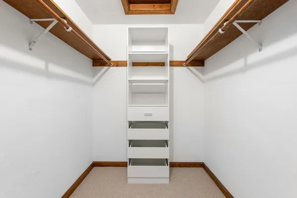 a view of an empty walk in closet