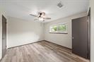 13726 Willie Melton Boulevard Kendleton, TX 77451 - Photo 7 of 12 an empty room with windows and fan