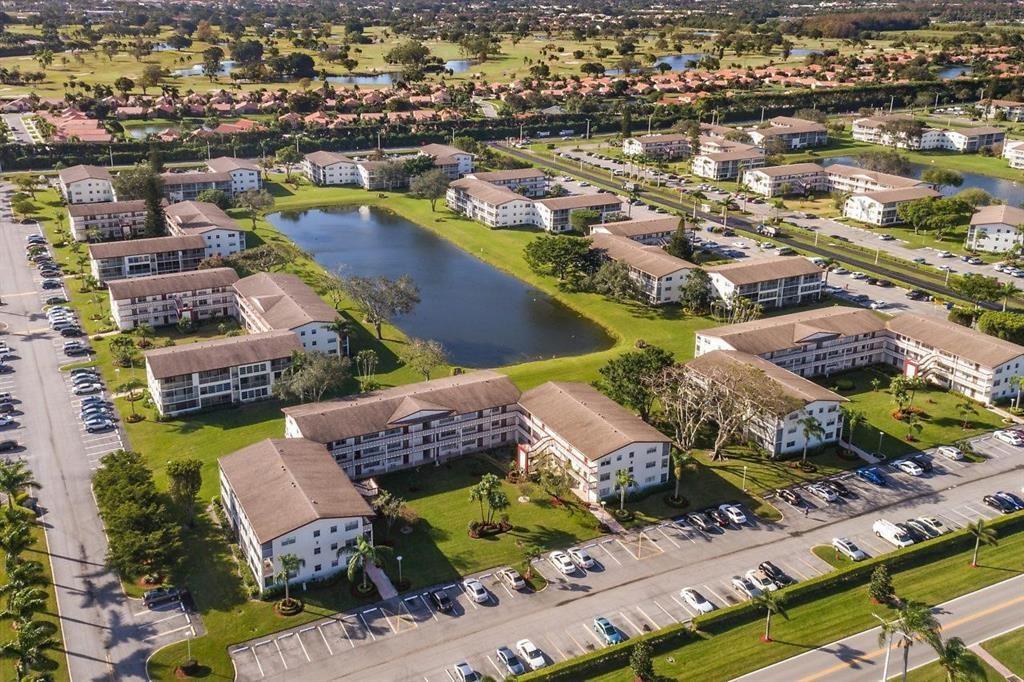 138 Fanshaw D, Unit D Boca Raton, FL 33434 - Photo 12 of 22 an aerial view of residential houses with outdoor space