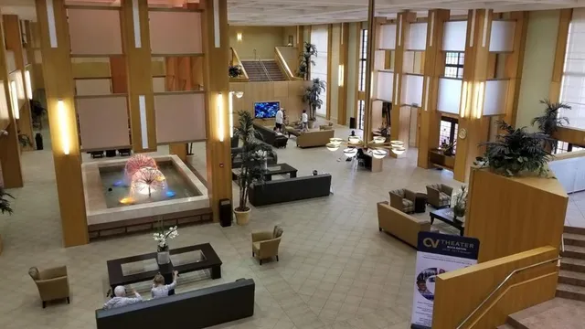 a room with furniture and gym equipment