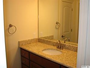 155 Sink Farm Road Mooresville, NC 28115 - Photo 15 of 16 a bathroom with a granite countertop sink and a mirror