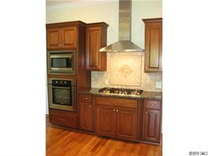 155 Sink Farm Road Mooresville, NC 28115 - Photo 5 of 16 a kitchen with stainless steel appliances granite countertop a stove and a refrigerator