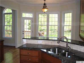 155 Sink Farm Road Mooresville, NC 28115 - Photo 7 of 16 a kitchen with granite countertop a sink and a window