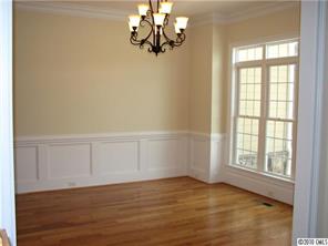 155 Sink Farm Road Mooresville, NC 28115 - Photo 8 of 16 a view of an empty room with wooden floor and a window