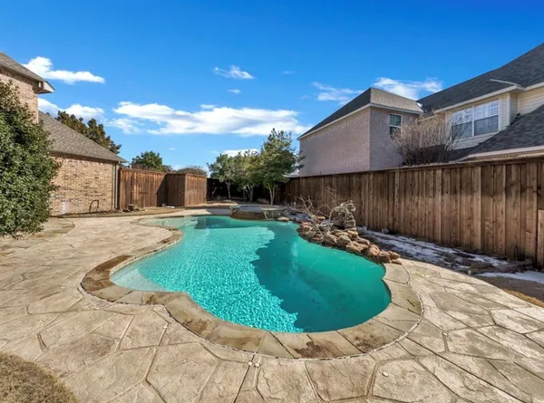 a view of a backyard with sitting area