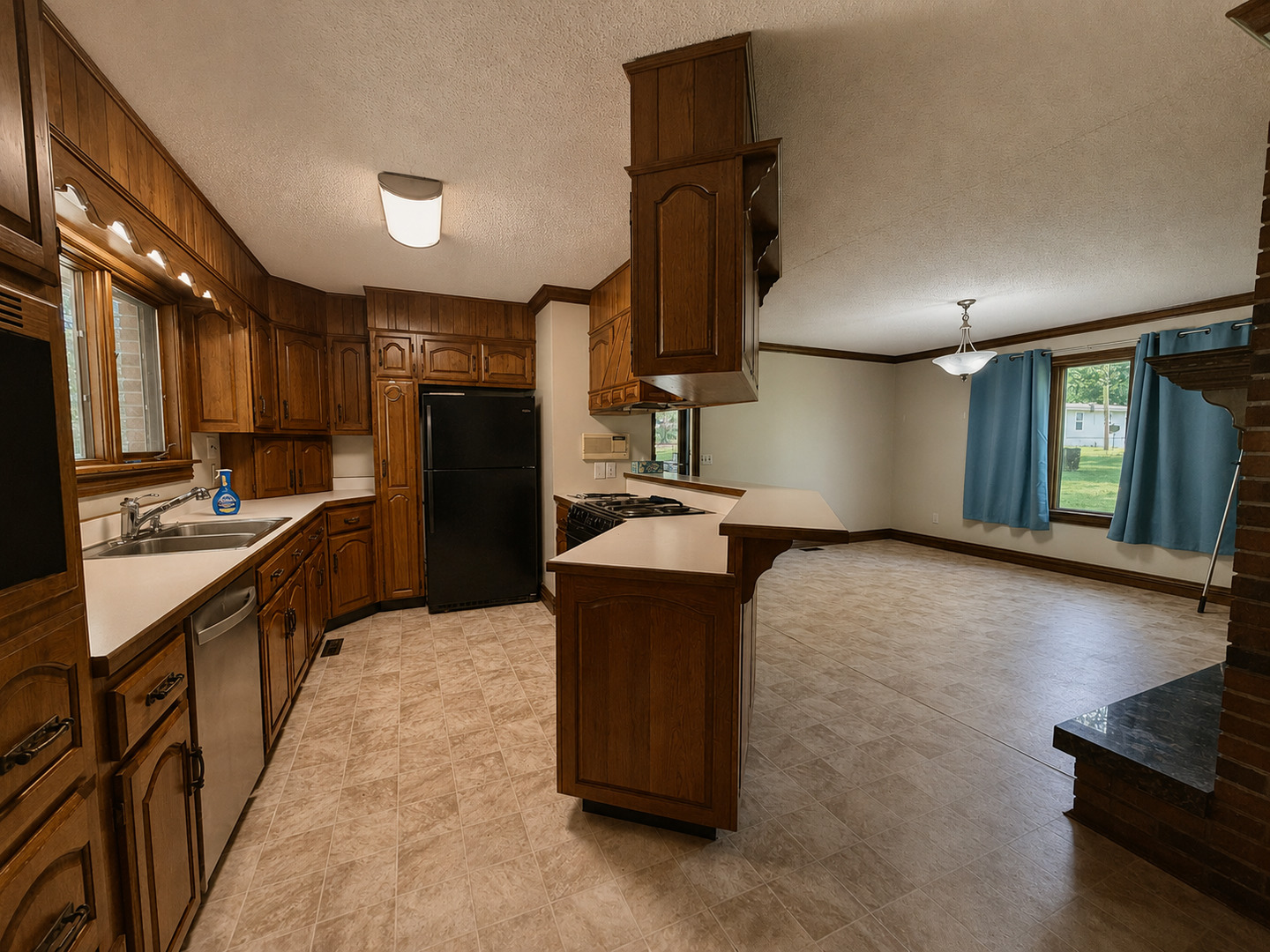 5996 South US 45 Road Metropolis, IL 62960 - Photo 10 of 41 a kitchen with stainless steel appliances kitchen island granite countertop a refrigerator a stove and a sink with wooden floor