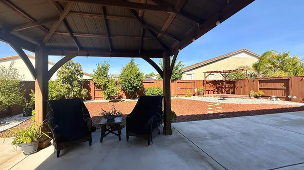 a view of swimming pool with outdoor seating