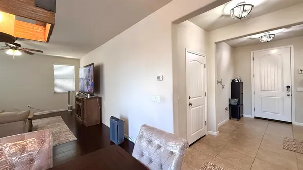 a view of a livingroom with furniture and windows