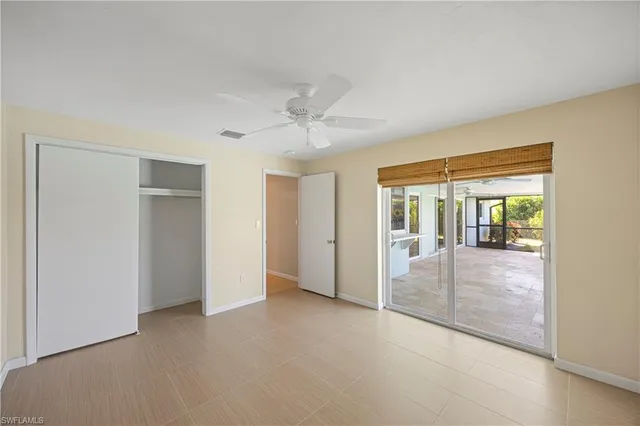 an empty room with windows and entrance