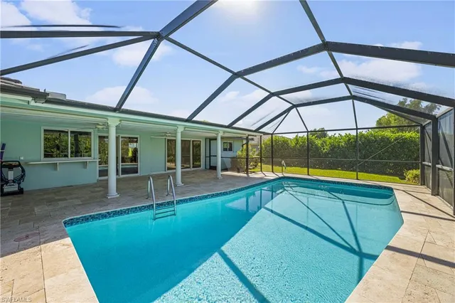 a view of indoor pool and sitting area