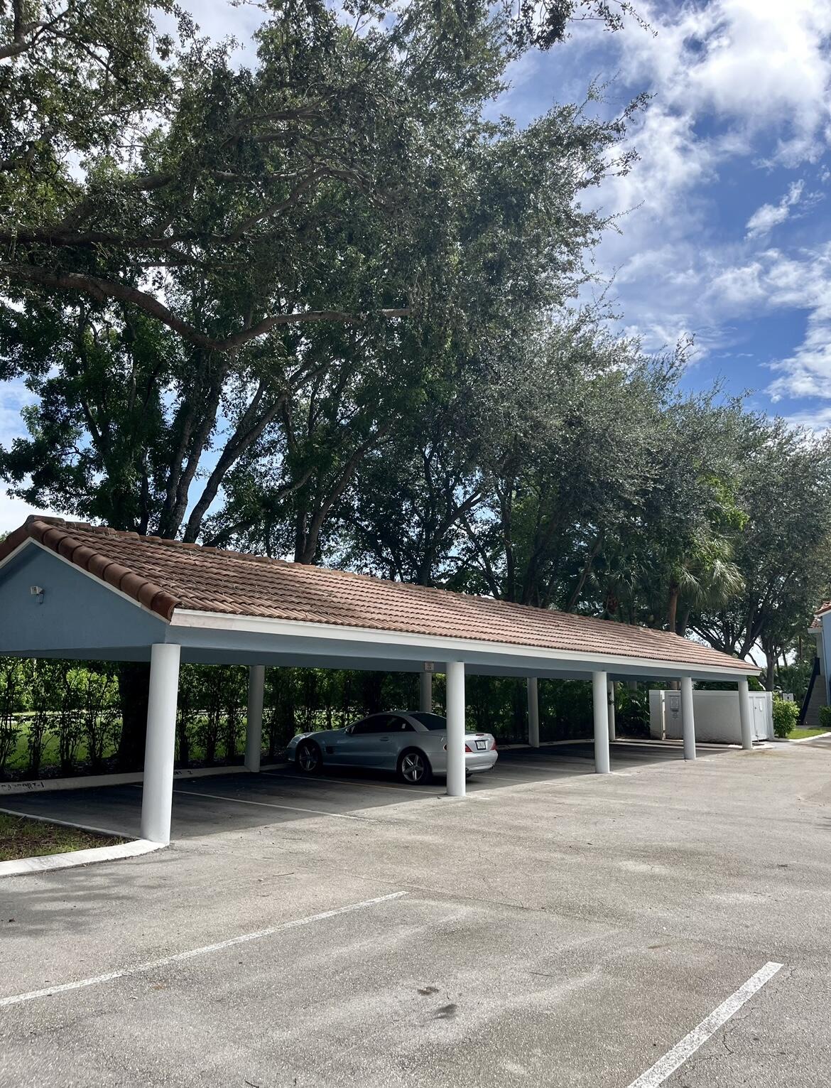 3299 Clint Moore Road, Unit 207 Boca Raton, FL 33496 - Photo 25 of 32 Carport space