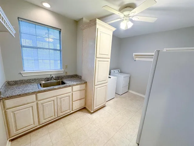 a bathroom with a double vanity sink a toilet and a mirror