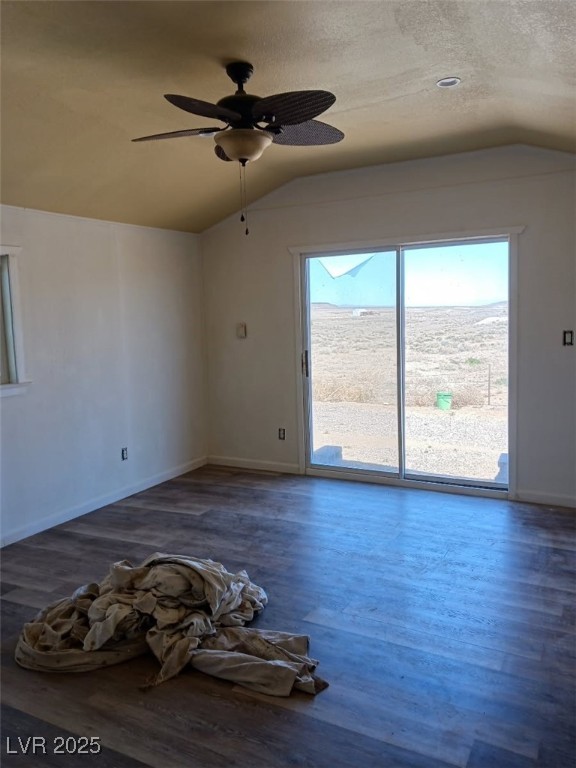 1208 Broadway Street Goldfield, NV 89013 - Photo 20 of 23 Unfurnished room featuring a textured ceiling, lofted ceiling, and wood finished floors