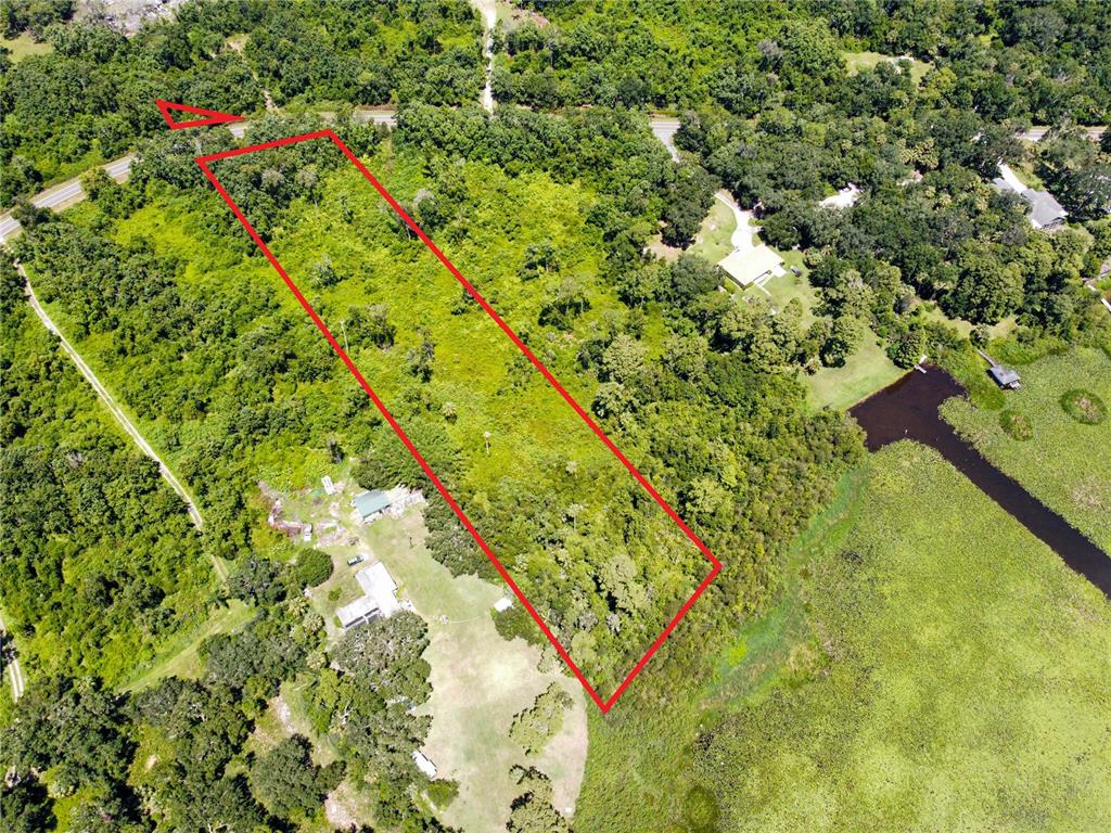 Timberlane Rd Lake Lake Wales, FL 33898 - Photo 6 of 10 a backyard of a house with lots of green space and trees