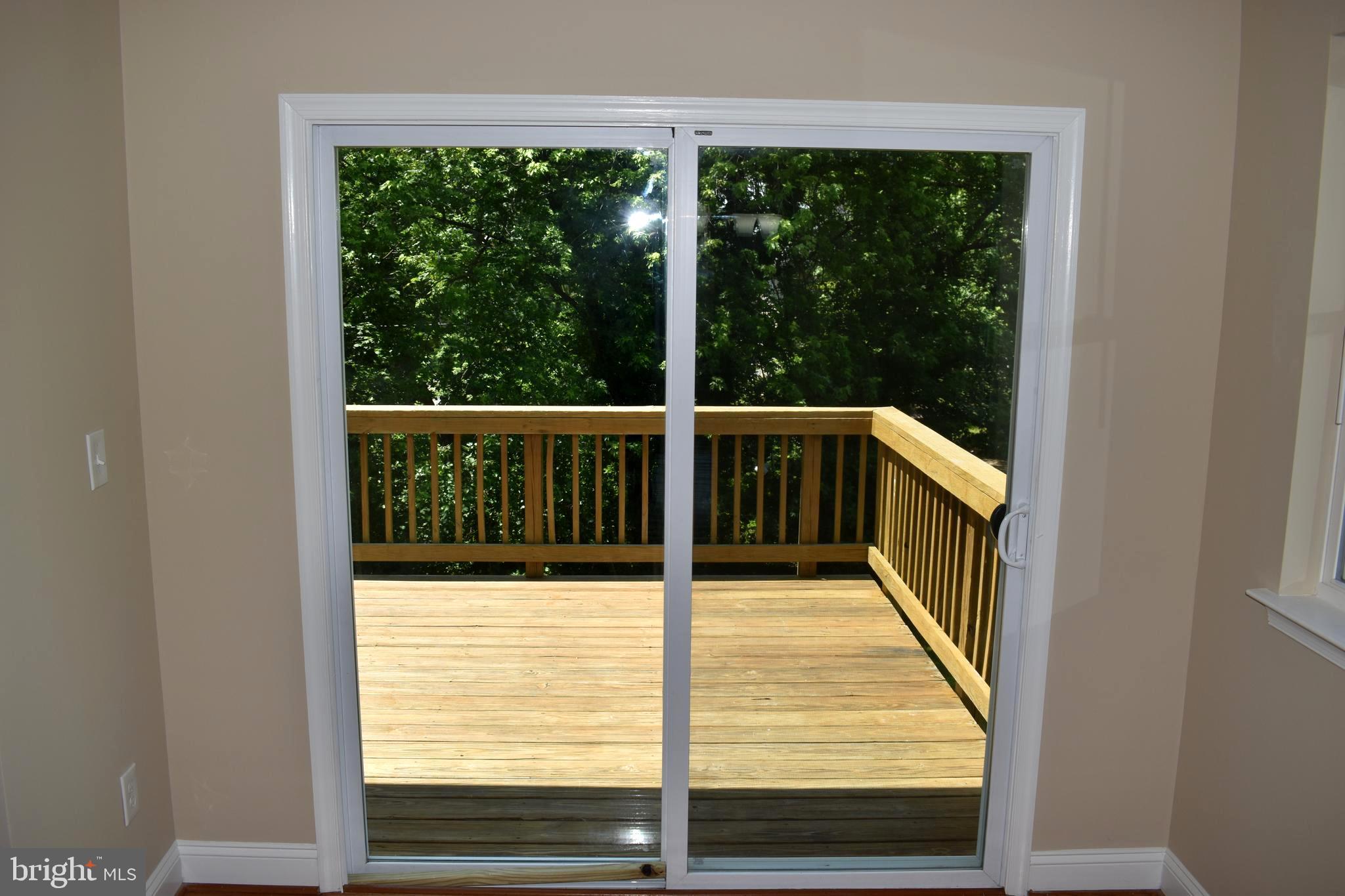 4211 Moravia Road Baltimore, MD 21206 - Photo 10 of 31 Sliding Glass Doors Leading To Deck