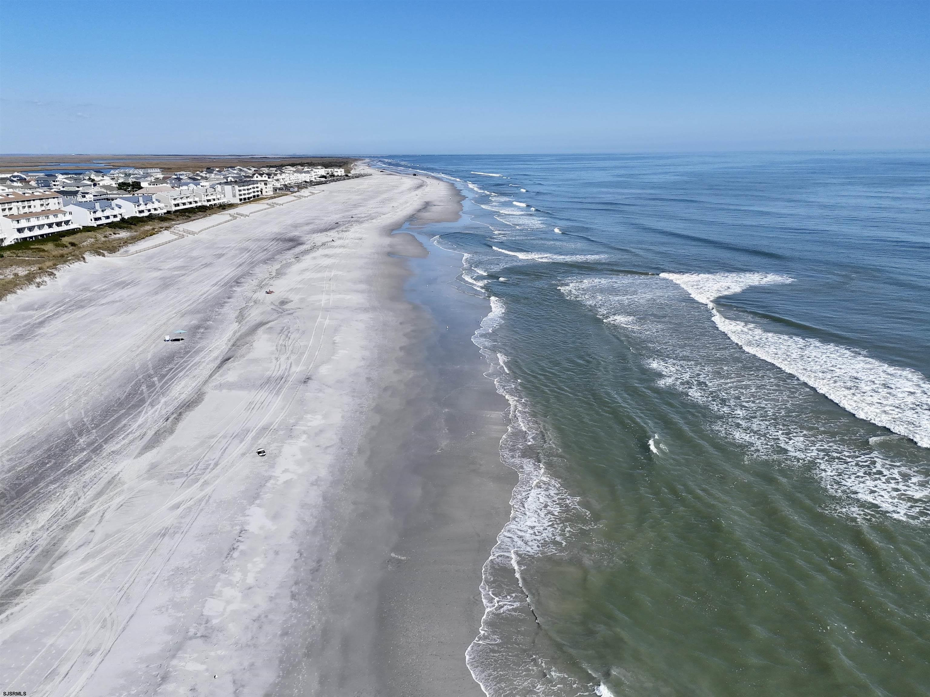 107 East Brigantine Avenue, Unit 211 Brigantine, NJ 08203 - Photo 11 of 34 a view of an ocean beach