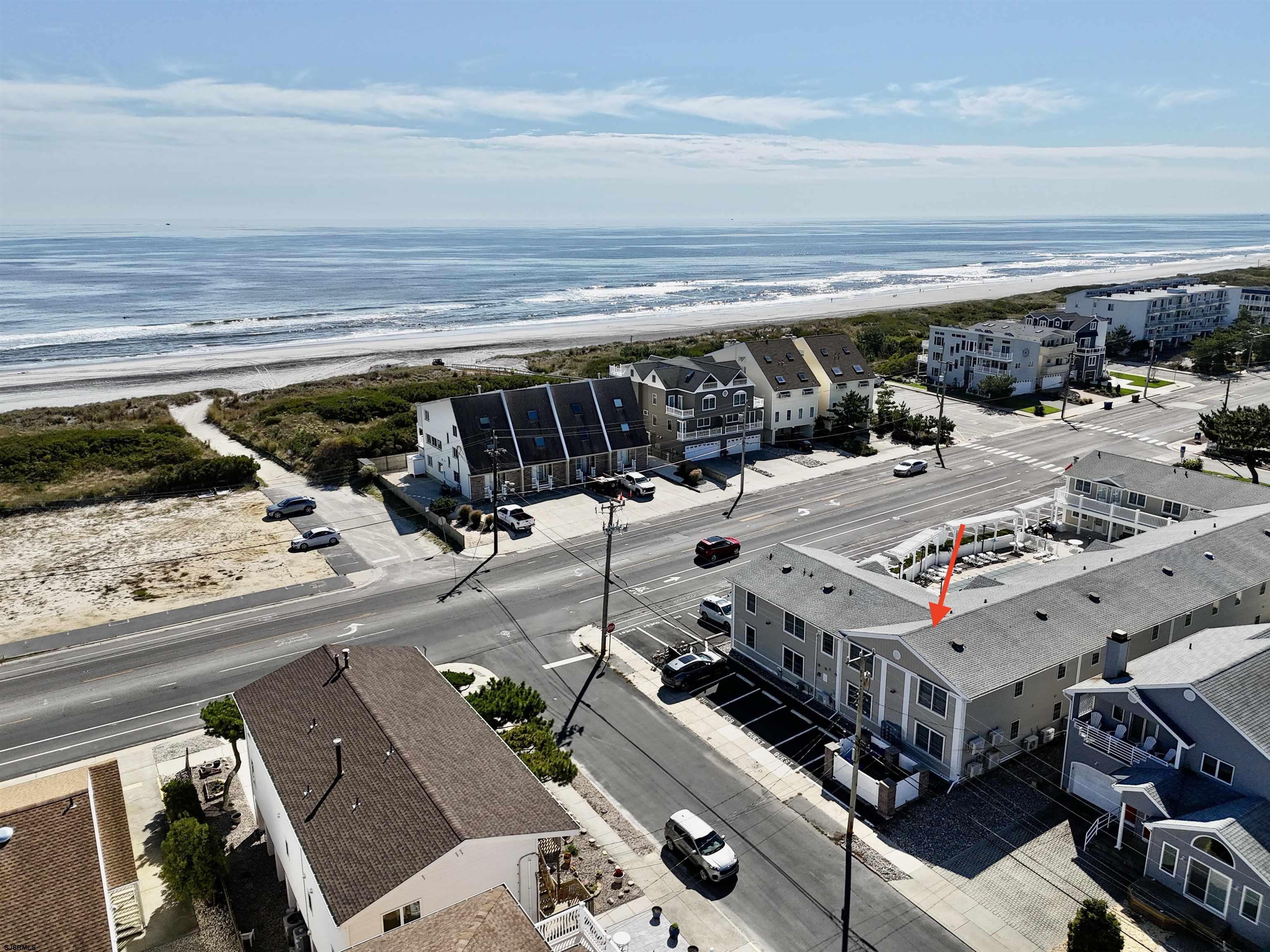 107 East Brigantine Avenue, Unit 211 Brigantine, NJ 08203 - Photo 13 of 34 a view of a patio with table and chairs